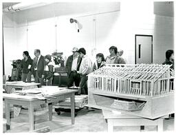 People Looking at Woodshop Projects (Part of the NMU Historic Photographs Collection)