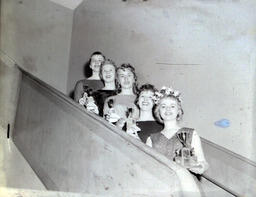 All Events Weekend 1959: Five Women Posed With Trophies on Stairs