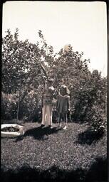 (016-009) Two Children Posing in Backyard