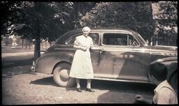 (043-004) Older Woman Posing with Car